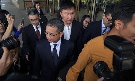 City Harvest Church (CHC) founder and senior pastor Kong Hee (centre) leaving the Supreme Court last Friday with his lawyer, Mr Edwin Tong, in front of him. Kong has said through his lawyer that he will study the filing by the Attorney-General's Cham
