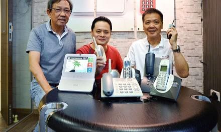 From left: Astralink executive director Fong Hean Chuan, chief technology officer Ng Chin Tiong and CEO Bill Chang with some of the firm's products past and present. 