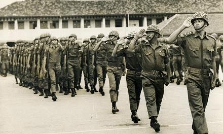 Mr Othman Wok, then a lieutenant in the People's Defence Force as well as the Minister for Social Affairs, leading the troops during a passing-out parade in 1969. Those who knew him said he was a man who, despite his stature, was respectful and humbl