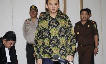 Jakarta Governor Basuki Tjahaja Purnama at his trial yesterday. Prosecutors said that while he should be found guilty of insulting Islam, his actions did not warrant prison time, and they recommended a two-year probation in lieu of a suspended one-ye