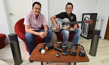 Co-founders of XMI and brothers Reuben (left) and Ryan Lee, who is the chief executive, with some of the company's audio products. Despite financial mismanagement, wireless technology disruption and lost margins due to e-commerce, XMI - after a fund-