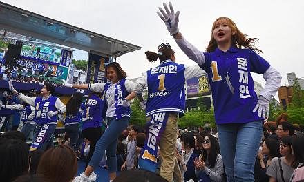 Supporters of South Korean presidential candidate Moon Jae In of the Democratic Party dancing during an election campaign in Goyang city, north-west of Seoul, last Thursday.