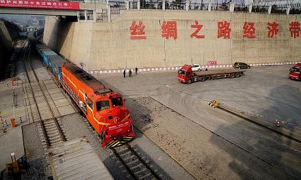 A freight train from Kazakhstan, carrying wheat, arriving at the China-Kazakhstan Lianyungang Logistics Cooperation Base last week. The shipment will be repackaged in China and transported to Vietnam by sea.