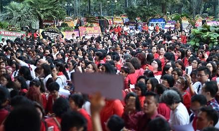 Supporters of Basuki Tjahaja Purnama, also known as Ahok - who is non-Muslim and an ethnic Chinese - gathering at City Hall in Jakarta yesterday. His guilty verdict and sentence of two years' jail over a speech he gave last September have thrust Indo