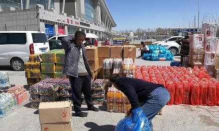 Buyers working for supermarkets in Xinjiang with goods they have just carried out of the China-Kazakhstan cross-border zone. Trade continues to be low-margin in nature, primarily taking advantage of the lack of import taxes for things such as consuma