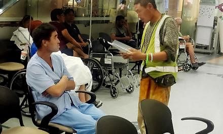 Two of the injured workers at Changi Hospital yesterday. Of the 10 who were hurt, seven were admitted, while three have been discharged after being treated.