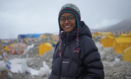 Ms Nur Yusrina Ya'akob at Everest base camp (left) and on the summit in May. Her desire to climb the world's highest peak stems partly from her love for challenges. "If I don't put myself in a difficult situation, that's not me. I look for challenges