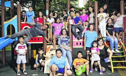 Ms Lin Shiyun (centre, in blue and white top) started Let's Go Play Outside! for children from low-income families in Toa Payoh Lorong 1, where there are some blocks of rental flats and a park with two playgrounds (below). Initially, the activities w