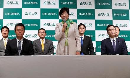 Tokyo Governor Yuriko Koike, founder of the new Party of Hope, at a news conference to announce the party's campaign platform with her party members in Tokyo last month. As a successful woman in power in Japan, she has smashed what she refers to as a
