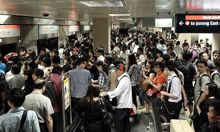 Left: Commuters at Bishan MRT station waiting for trains on Dec 15, 2011, after a massive breakdown of services on the North-South Line. Above: Last month's heavy flooding in MRT tunnels had emergency responders from the Singapore Civil Defence Force
