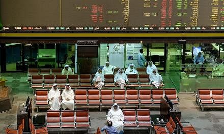 Traders at the Kuwait Stock Exchange. A sell-off across Gulf stock markets was prompted in part by the anti-corruption arrests in Saudi Arabia. Saudi Arabia's stock market continued to fall in early trade yesterday.