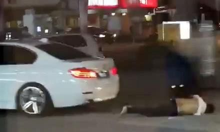 Screengrabs from video footage showing the victim being run over by the assailants' car before it sped off. The victim, who was assaulted and stabbed, died.