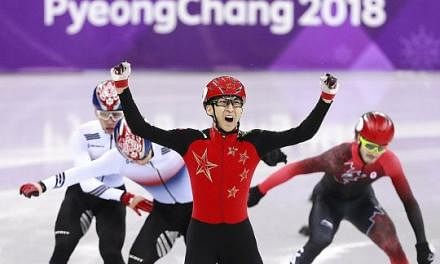 Wu Dajing is ecstatic after winning the thrilling 500m short-track speed skating final in a world record at the Gangneung Ice Arena last night. It was China's first gold of these Winter Olympics.