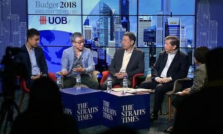 At the Budget roundtable were (from left) UOB economist Francis Tan, Koda sales and marketing executive director Ernie Koh, MP and NTUC director Melvin Yong, Singapore Business Federation chairman Teo Siong Seng and moderator Lee Su Shyan, Business e