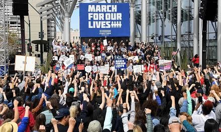 Protesters at the March For Our Lives rally on Saturday in Las Vegas, where a gunman killed 58 people at a country music festival last year. More than 800 demonstrations were scheduled in the US and overseas, said coordinators, with events as far as 
