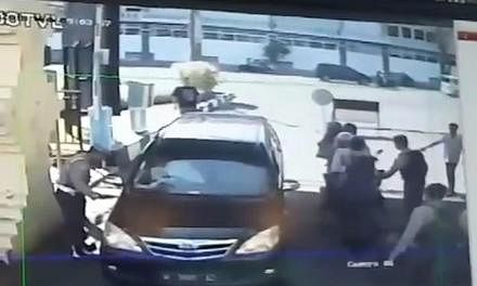 Stills from CCTV footage showed people on motorcycles detonating bombs at the gate of the Surabaya police station yesterday. The blast left 10 people injured. The father from the family that struck the police station was from the same terror cell as 