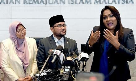 (From left) Deputy Minister in the Prime Minister's Department Fuziah Salleh; Datuk Dr Mujahid Yusof Rawa, Minister in the Prime Minister's Department (Religion); and transgender Nisha Ayub at Jakim on Aug 10.
