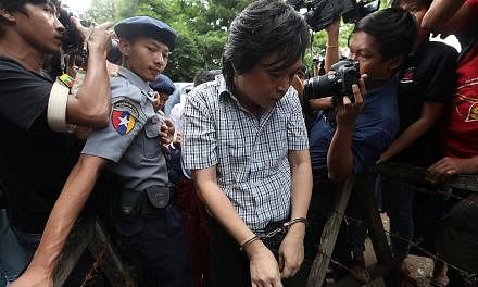 Nayi Min, one of three journalists from Eleven Media group arrested for incitement on Oct 10 after the Yangon region government lodged a criminal complaint over an article, arriving at Tamwe court in Yangon that day. The trio were freed on bail last 