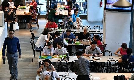The NTUC Foodfare foodcourt at Khoo Teck Puat Hospital. The chain's foodcourts feature value meals and healthier options. Halim's fish soup comes with thick slices of fish.
