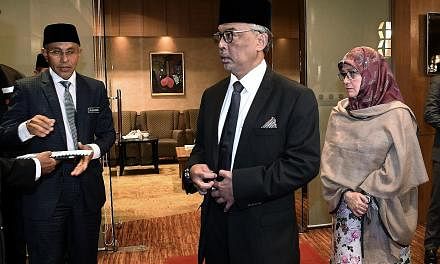 Pahang Regent Tengku Abdullah Sultan Ahmad Shah and his wife, Tunku Azizah Aminah Maimunah Iskandariah Sultan Iskandar, at the Pahang Royal Council Meeting in Kuala Lumpur on Friday.