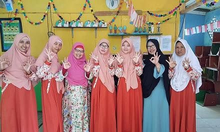 Ms Dwi Septiawati Djafar (third from left) of the Prosperous Justice Party with her constituents. She is running for office in Bekasi, Karawang and Purwakarta regencies in West Java to push for the empowerment of women, children and families. The upc