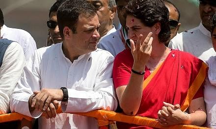 Congress leader Rahul Gandhi and his sister Priyanka at an election roadshow in Amethi on April 10.