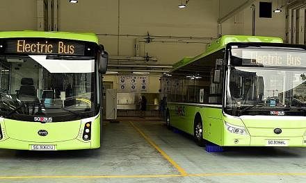 Above: Electric buses from Chinese firms BYD (left) and Yutong. Right: A diesel bus retrofitted with an electric power train, in an experiment by LTA as part of a proof-of-concept trial to determine the feasibility of converting existing diesel buses