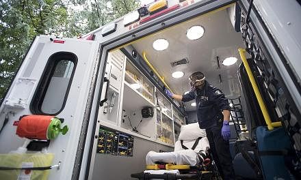 Concern over the suspected Covid-19 patient's oxygen levels led emergency doctor Mathieu Surprenant to make the call to intubate the patient, assessing that it was his best chance of survival. Paramedic Jeff Booton cleaning his ambulance in Lions Bay