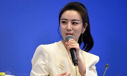 <p>This photo taken on April 20, 2021 shows e-commerce livesreamer Huang Wei, also known as Viya, speaking during the Boao Forum for Asia (BFA) in Boao, in south China's Hainan province. - A Chinese influencer known as the "queen of livestreaming" has bee