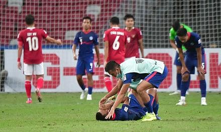 <p>ST20211225_202138853166 Desmond Wee_dlsoc25-ol /Singapore's Faris Ramli was lying down inconsolable after the match when  Indonesia beat Singapore 4-2 after Extra time during the Second leg of AFF Suzuki Cup semi-finals between Singapore and Indonesi
