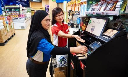 Hybrid checkout systems at Sheng Siong