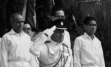 President Yusof Ishak, in military uniform, takes the salute at the Padang during Singapore's first National Day Parade in 1966. Mr Yusof, who died in office close to five decades ago, was Singapore's first and only Malay president so far.