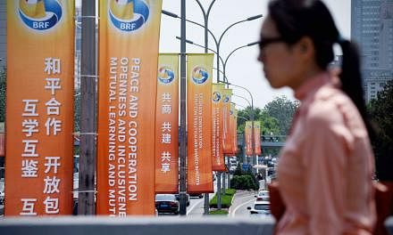Banners on display along a street on Tuesday, ahead of the Belt and Road Forum for International Cooperation in Beijing on Sunday. China is hosting the summit to showcase its ambitious drive to revive ancient Silk Road trade routes and lead a new era