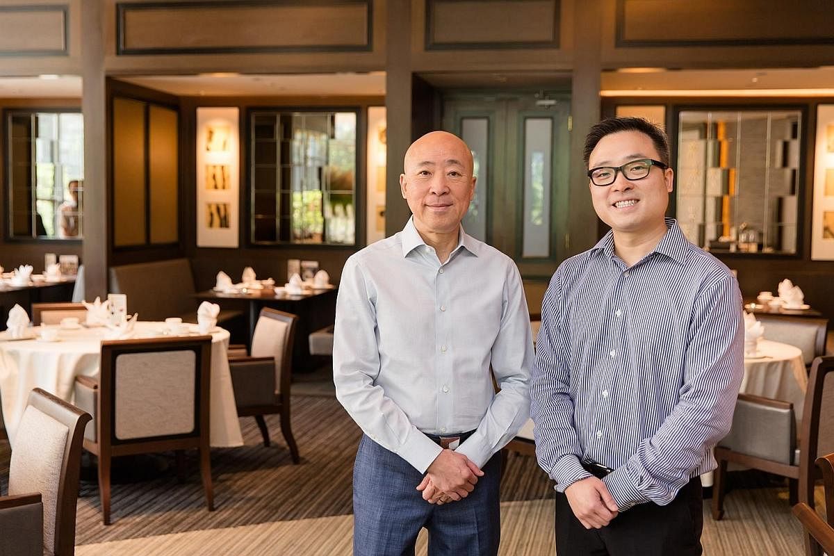 Imperial Treasure founder Alfred Leung (far left) with his son Kenny, who is being groomed to take over the reins of the business.