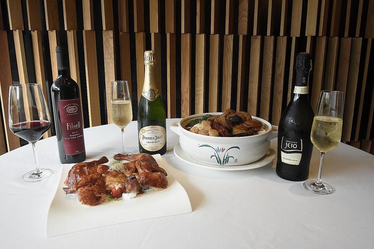 Dual Style Roasted and Sze Chuan "Bon Bon"' Chicken paired with Grant Burge Filsell Shiraz (left) from South Australia's Barossa Valley, and pen cai paired with either Champagne Perrier Jouet Grand Brut (centre) or Bisol Desiderio Jeio, Prosecco di V