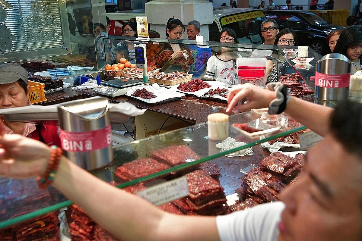 Yong tau foo ingredients at Chinatown wet market also drew crowds shopping for their reunion dinners. Festive decorations, a must-have among many households to usher in the Year of the Rooster, were popular items at the bazaar. Traditional Chinese Ne