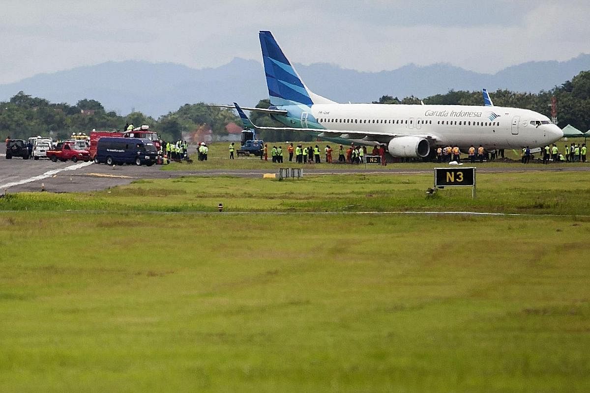 A Garuda Boeing 737-800 from Jakarta carrying 130 people skidded off the runway as it landed at the Yogyakarta airport late on Wednesday, the airline said yesterday. It is the latest mishap to hit Indonesia's aviation sector. No one was hurt, but the