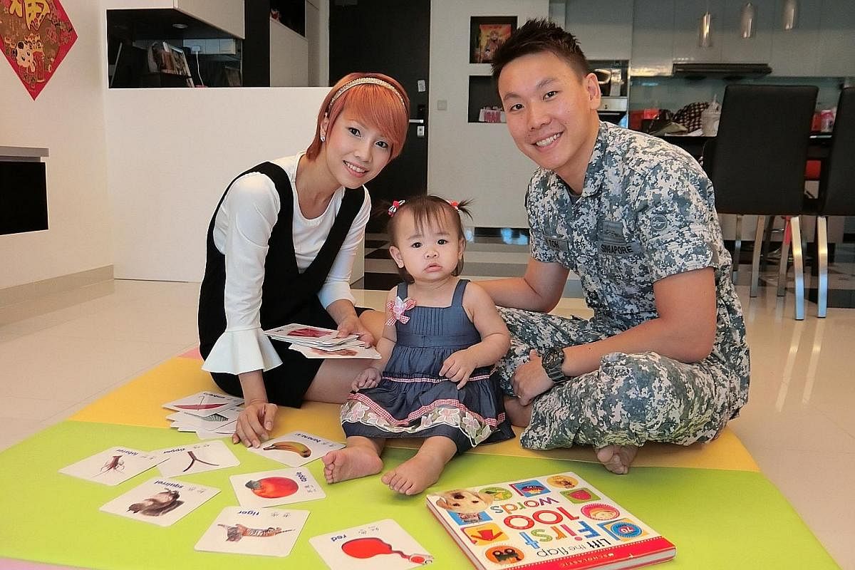 (Left) Major Kody Toh Guan Hong and his wife Joanna Khoo with their daughter Rayna, whom he bathes and takes to swimming class. (Right) Teacher Yonatan Ng and his wife Eunice Tan take turns doing chores, including changing the diapers of their son, N