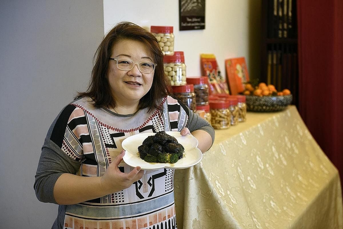 Mrs Lesley Ma with her sweet mushrooms, given an auspicious spin with black moss.