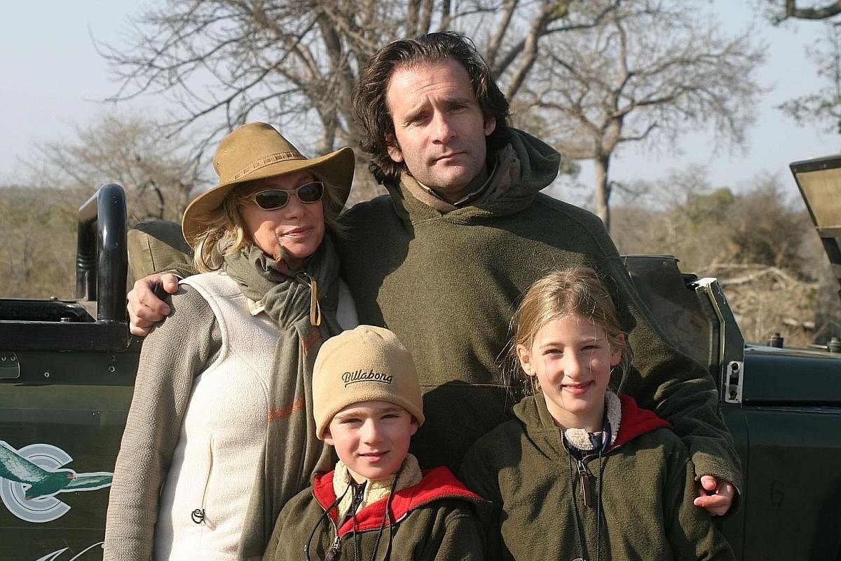 My life so far: Mr Tollman with his wife, Toni, and his children, Jack and Deia, in South Africa in 2002.
