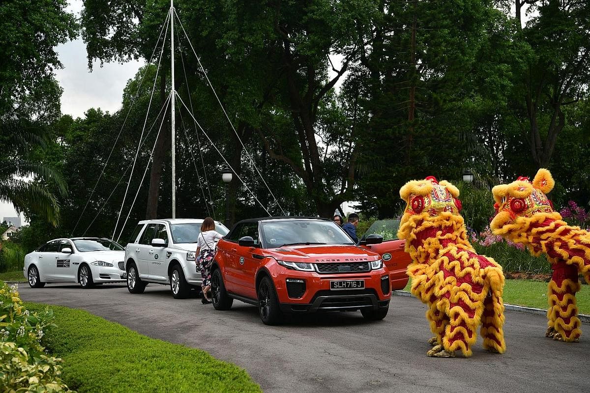 The finalists receiving a grand welcome at the awards ceremony yesterday. They were ferried by a fleet of 10 Land Rovers and two Jaguars, and greeted with a lion dance performance. Paralympians Yip Pin Xiu (left) and Theresa Goh with Dr Chi Wei Ming 