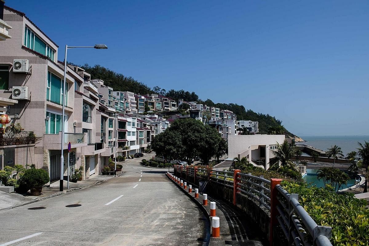 The street outside an oceanfront villa (centre left), one of the properties where Mr Kim Jong Nam was believed to have lived in Macau. Even though he lived overseas, Mr Kim was still seen as a threat by Pyongyang. Mr Kim Jong Il with his youngest son