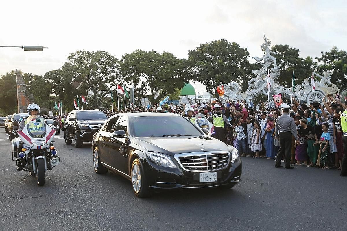 King Salman, in the front car, arriving on Saturday in Bali, where he is on holiday till Sunday. In Indonesia, his motorcade includes several armoured vehicles, his personal bodyguards and Indonesian troops. A soldier on alert in an armoured personne