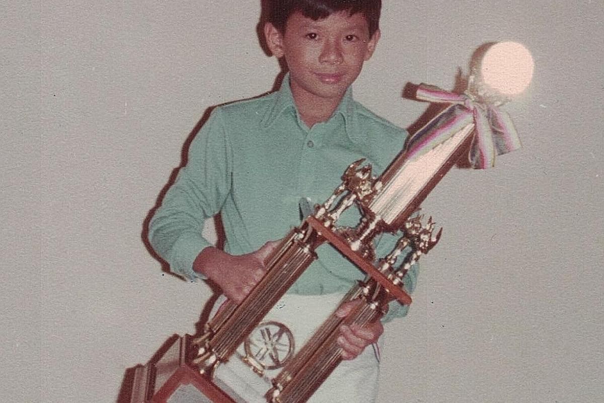 My life so far: Goh Kheng Long celebrating his wife Tay Ting Ting's birthday with Hong Kong pop star Jacky Cheung in January; and Goh, aged 11 (above), when he won the Yamaha Electone Competition in 1978.