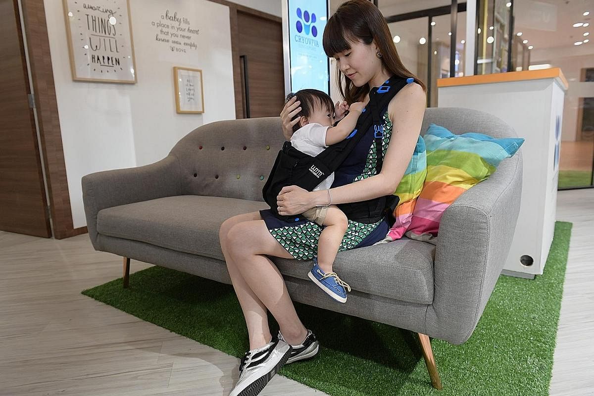 Lifestyle blogger Janice Leong, who gave birth less than two weeks ago, wears a side-access breastfeeding garment by Mothers en Vogue. Ms Cindy Gan, who runs a content marketing business, breastfeeding her son Leroy in a nursing outfit from Bove by S