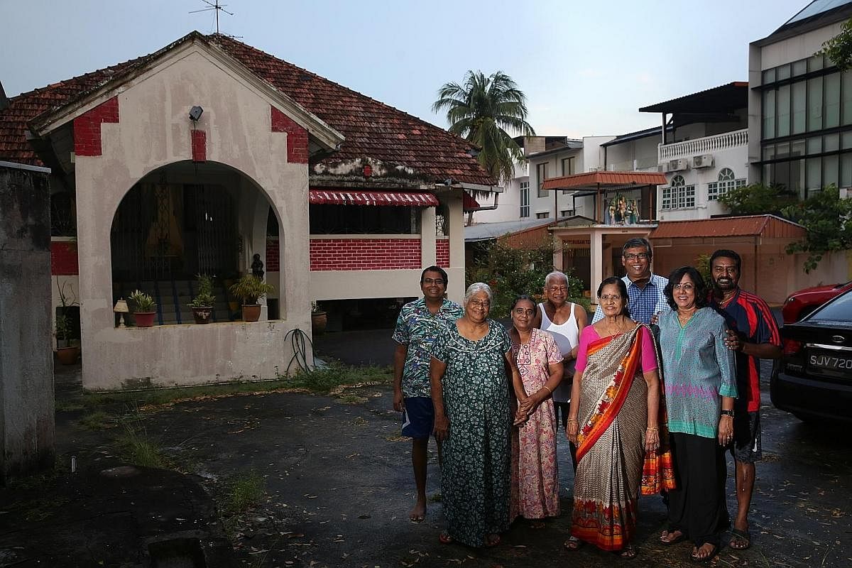 (From left) Mr Sivakumar Kuppusamy Ragunathan, Madam Vasantha Kuppusamy, her maid Vedi, Mr Kanagaratnam Ragunathan, Mrs Raja Lechimi Vasagar, Mr Krishna Kumar, Madam Kuppusamy Kamala and Mr Balakrishnan Arunasalam at Lakshmi Villa, which has a family