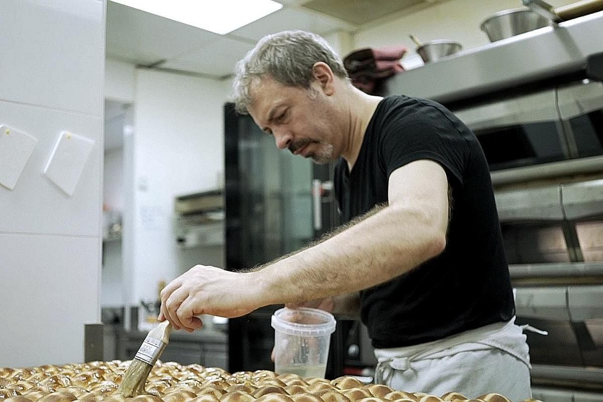 French pastry chef Frederic Deshayes making hot cross buns.