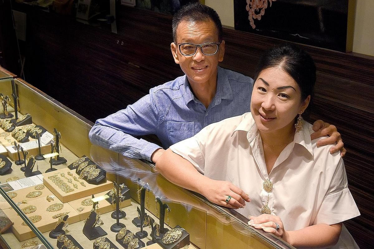 Mr Thomis Kwan focuses on the design and production of his company's Peranakan-style jewellery while his wife, Ms Caroline Tay (both above), handles sales and customer service.