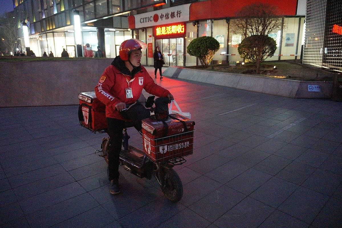 Mr Xie's day includes picking up orders from restaurants and sending the food to destinations across Beijing, which include both offices and homes. He also delivers fresh produce such as raw pork. Jiangsu native Xie Geng arrived in Beijing last month