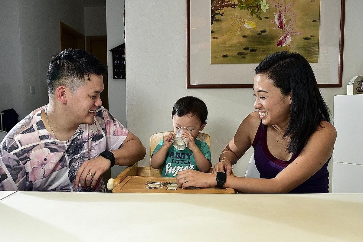 Mr Wesley Loh has been giving his sons Ethan (left), five, and Benjamin, eight, fresh milk since they were about two years old. Mrs Alethia Lee, 29 (with husband Lee Ying Quan, 30) breastfed her son Kester until he was 15 months old before giving him